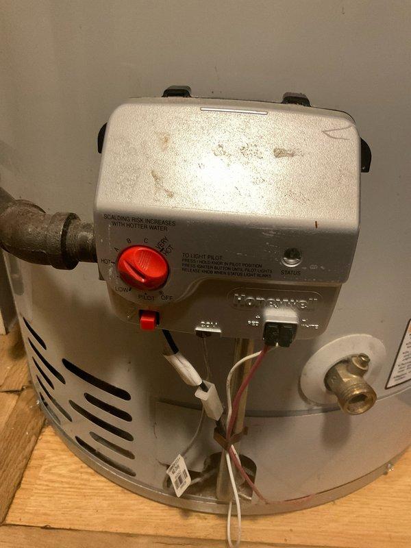 Completed routine home plan plumbing inspection on a 10-year-old Defender Safety System tanked water heater. Assessed overall unit condition, verified proper operation of temperature controls and pressure relief valve, inspected all visible plumbing connections including copper supply lines and brass fittings, and documented equipment status with photographic records. Unit found to be operational with normal age-related wear present.