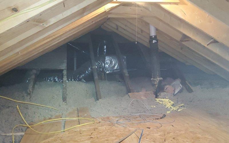 Completed routine maintenance inspection on residential cooling system. Verified outdoor condensing unit operation, confirmed proper airflow through coil louvers, and inspected refrigerant line insulation along exterior wall. Checked condensate drain lines for proper discharge and verified unit mounting stability on concrete pad. Accessed attic space to inspect supply ductwork routing and insulation coverage around air distribution system. Confirmed flex duct connections secure and electrical wiring properly routed through attic space. All system components operating within normal parameters with no deficiencies noted during this scheduled maintenance visit.