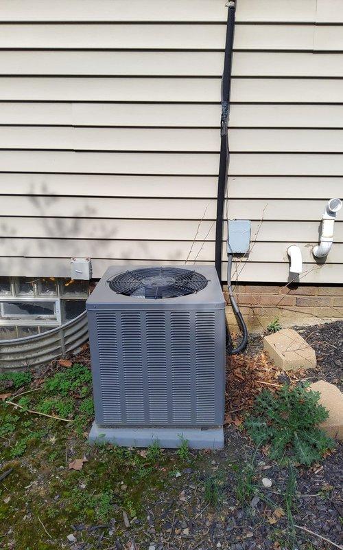 Completed routine maintenance inspection on residential cooling system. Verified outdoor condensing unit operation, confirmed proper airflow through coil louvers, and inspected refrigerant line insulation along exterior wall. Checked condensate drain lines for proper discharge and verified unit mounting stability on concrete pad. Accessed attic space to inspect supply ductwork routing and insulation coverage around air distribution system. Confirmed flex duct connections secure and electrical wiring properly routed through attic space. All system components operating within normal parameters with no deficiencies noted during this scheduled maintenance visit.