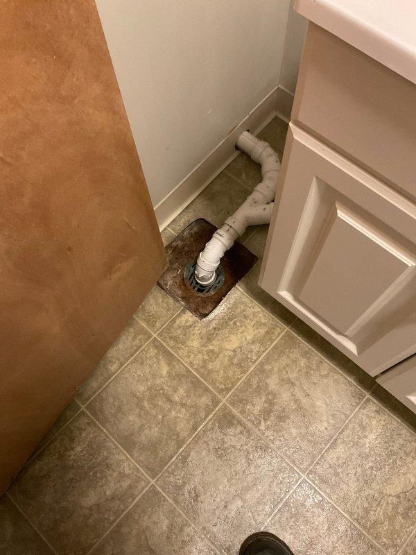 Responded to service call for multiple plumbing issues in laundry area including water heater flush, leaking washing machine supply line, and backed-up laundry drain. Upon inspection, identified active leak at water supply line connection feeding the washing machine and assessed laundry drain system with exposed PVC piping showing signs of drainage issues. Performed water heater flush to remove sediment buildup, repaired leaking waterline connection with new fittings and supply line, and cleared laundry drain obstruction to restore proper drainage flow. Tested all repairs for proper operation and verified no additional leaks present.