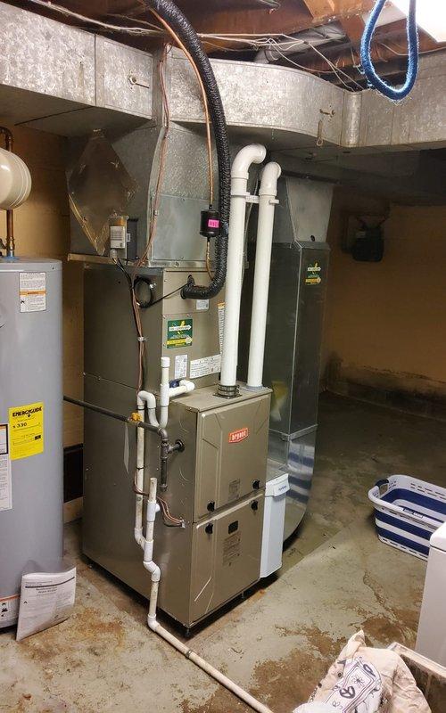 Performed seasonal system startup and operational check on Bryant air conditioning system with availability window of 8-12 following advance customer notification. Inspected outdoor condenser unit, verified proper fan operation, and assessed overall system condition. Evaluated indoor furnace and air handler equipment in basement, confirmed proper ductwork connections and venting configuration. System successfully started and running within normal parameters.