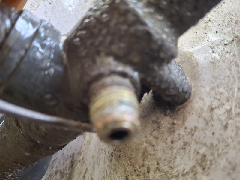 Completed comprehensive cooling system maintenance on a 23-year-old air conditioning unit as part of scheduled home plan service. Performed standard tune-up procedures including inspection of evaporator coil assembly, which showed normal dust accumulation on aluminum fins with proper fin spacing and airflow clearance. Examined refrigerant line connections and drain line assembly at concrete penetration point, noting age-appropriate surface wear but functional integrity of all components. All system components inspected and found operational within acceptable parameters for unit age.