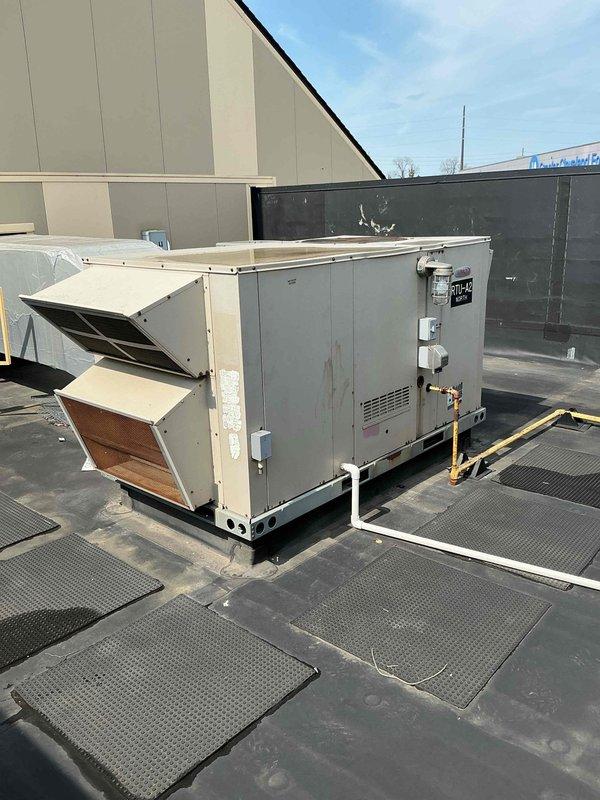 Conducted comprehensive site assessment of nine rooftop HVAC units for replacement estimate purposes. Documented existing packaged rooftop units, including equipment specifications, mounting configurations, refrigerant line routing, electrical disconnect locations, and roof conditions. Photographed all units, noting curb adapter dimensions, walkway pad locations, and accessibility requirements for future replacement planning.