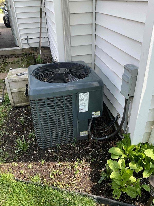 Completed HVAC estimate for replacement of outdoor air conditioning condenser unit due to chronic refrigerant leak requiring annual recharging. The existing 5-6 year old condenser unit exhibited signs of ongoing coolant loss, indicating system integrity compromise. Assessed equipment condition, documented existing installation on concrete pad against exterior wall with proper clearances, and evaluated indoor air handler components in basement. Provided comprehensive replacement estimate for new condensing unit with proper refrigerant specifications and warranty coverage.