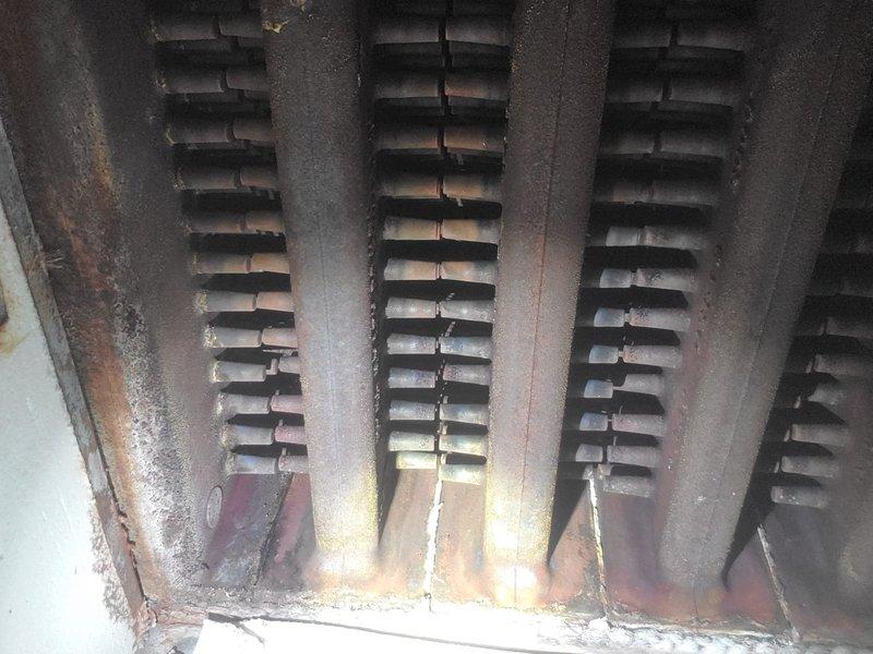 Completed comprehensive maintenance on residential HVAC system including hot water boiler and air conditioning unit. Inspected heat exchanger components, noting age-related surface oxidation on finned tubes while confirming structural integrity and proper heat transfer capability. Performed standard maintenance procedures on basement mechanical equipment, checked all copper piping connections, verified expansion tank operation, and ensured proper ventilation system function with all components operating within normal parameters.