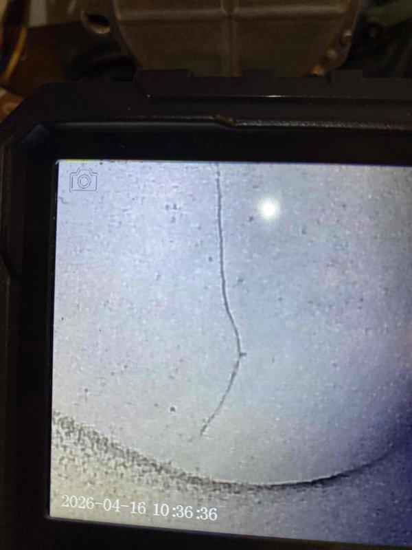 Responded to service call for furnace leaking water at base of 20-year-old unit. Upon arrival, performed visual inspection and documented conditions with photographs. Identified rust-colored staining and water damage on metal base panels and interior components, indicating active or recent water leakage. Inspected condensate drain system, evaporator coil area, and heat exchanger for potential leak sources. Given the age of the equipment and extent of corrosion observed, discussed repair versus replacement options with homeowner. Provided recommendations for addressing the water leak issue and preventing further damage to the unit and surrounding area.