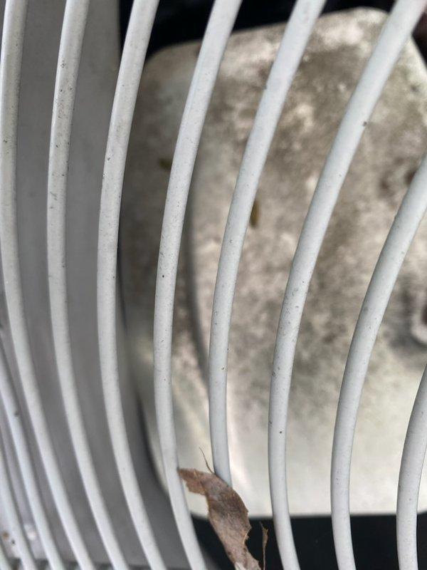 Responded to service call for 5-year-old air conditioning unit rendered inoperable after impact from falling ice caused severe denting to top housing, preventing fan blade rotation. Upon inspection, documented extensive physical damage to condenser unit cabinet and fan guard assembly with photographic evidence. Unit assessed as non-functional due to structural compromise; photos forwarded to management for evaluation regarding repair feasibility versus replacement recommendation.
