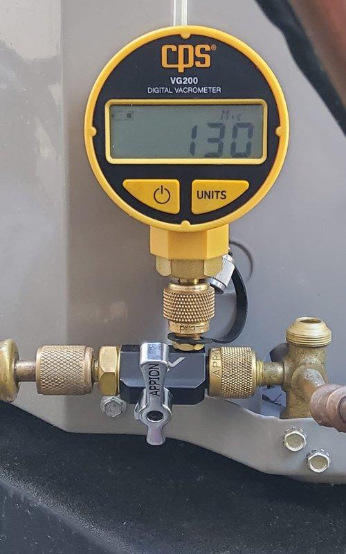 Replaced leaking filter drier using ProPress connection method to ensure secure, leak-free installation. System was evacuated to proper vacuum levels as confirmed by digital vacuometer readings, then recharged with refrigerant to manufacturer specifications.