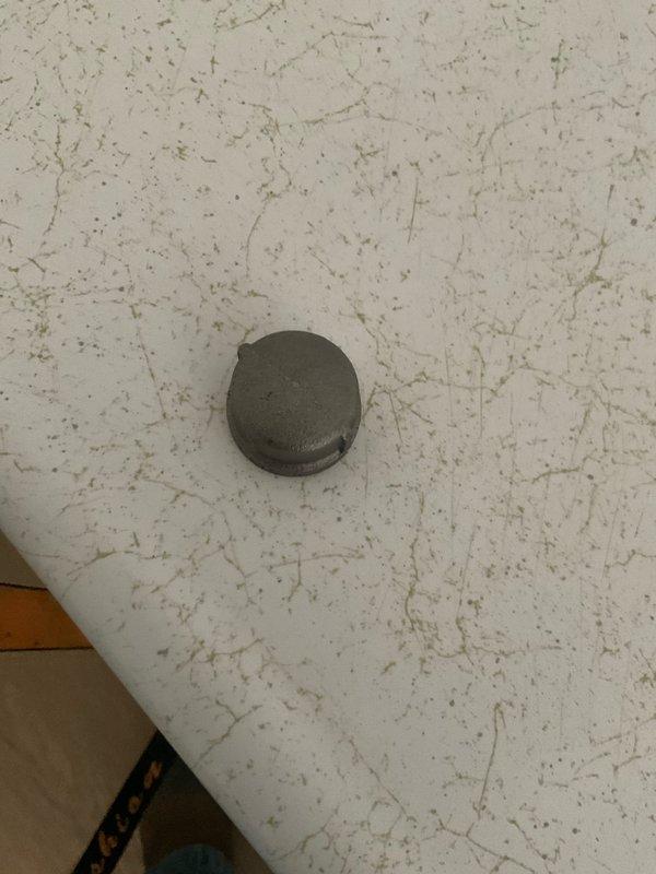 Responded to service request for gas line capping in century-old residential property. Successfully located and assessed the existing gas line, which required permanent capping to ensure safety and code compliance. Utilized appropriate pipe wrenches and hand tools to properly install a threaded gas line cap, securing the line to prevent any potential gas leaks. Completed installation per industry standards and verified seal integrity. Documented work with photographs showing tools used and the installed cap fitting.