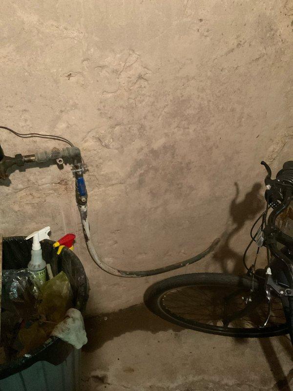 Responded to service call regarding water shut-off valve issue identified by water department. Inspected main water line shut-off valve assembly and associated plumbing components in basement mechanical room. Documented existing conditions of aged copper piping, pressure gauges, shut-off valves, and circulation system connections, noting signs of wear and patina on copper surfaces. Advised customer that water line repair or replacement at shut-off valve location would be required as indicated by municipal water department inspection.