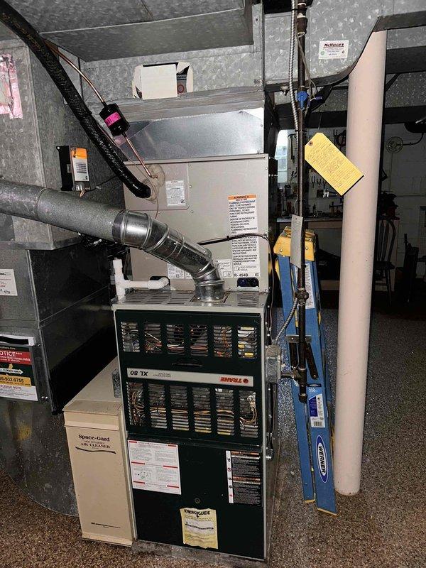 Completed full Bryant air conditioning system installation including outdoor condensing unit, indoor evaporator coil, thermostat, and refrigerant line set. System was charged with refrigerant, pressures verified and documented within manufacturer specifications, and all components tested for proper operation. Installation included integration with existing furnace system, proper insulation of refrigerant lines, and final system startup with performance verification.