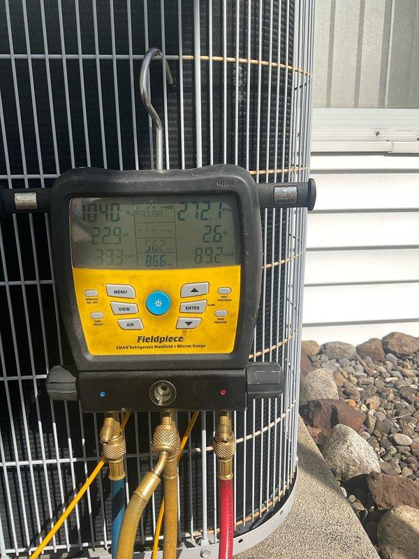 # AC Maintenance Completed

Performed comprehensive air conditioning maintenance on outdoor condensing unit. Connected digital manifold gauge set with refrigerant hoses to service ports to measure system pressures and temperatures. Utilized Fieldpiece SMAN diagnostic equipment to evaluate refrigerant charge levels, superheat, and subcooling values. Readings indicated system operating parameters were within acceptable range at 212.1°F discharge temperature with corresponding pressure readings of 313 PSIG. Conducted electrical testing with digital multimeter to verify proper voltage and amperage to compressor and condenser fan motor. All electrical components tested within manufacturer specifications. Inspected condenser coil fins for debris and damage, confirmed adequate airflow through unit. Verified fan motor operation and blade condition. System operating efficiently with no refrigerant leaks detected and proper cooling capacity restored.