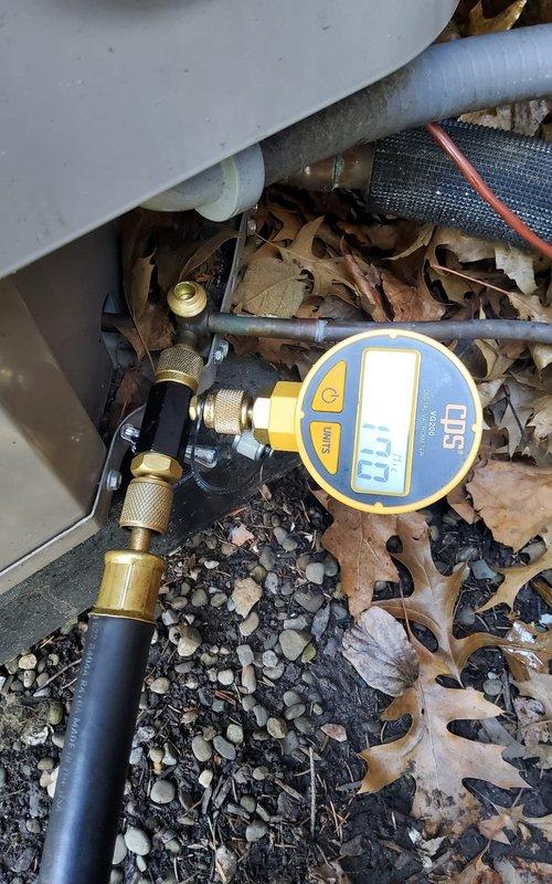 Recovered existing R-410A refrigerant from system and evacuated to proper vacuum levels. Recharged system with factory specification of 7.5 lbs of R-410A refrigerant plus UV dye for leak detection purposes, adjusting charge to manufacturer specifications. Follow-up visit scheduled in several weeks to perform comprehensive leak search using UV detection method, with customer understanding that dye may require additional time to circulate and identify leak location.