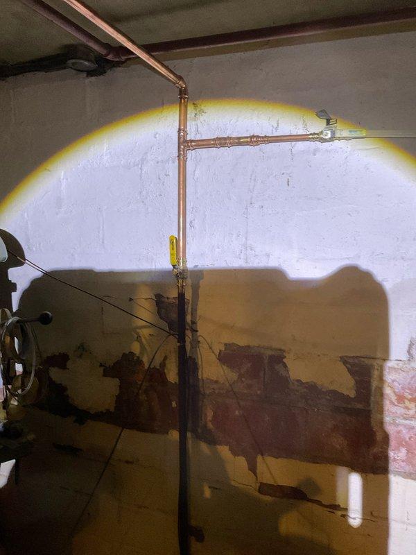 Replaced 30 feet of deteriorated galvanized water line with new copper piping in basement area. The installation included proper fitting connections and routing along existing utility pathways to restore water supply system integrity and prevent further leakage.