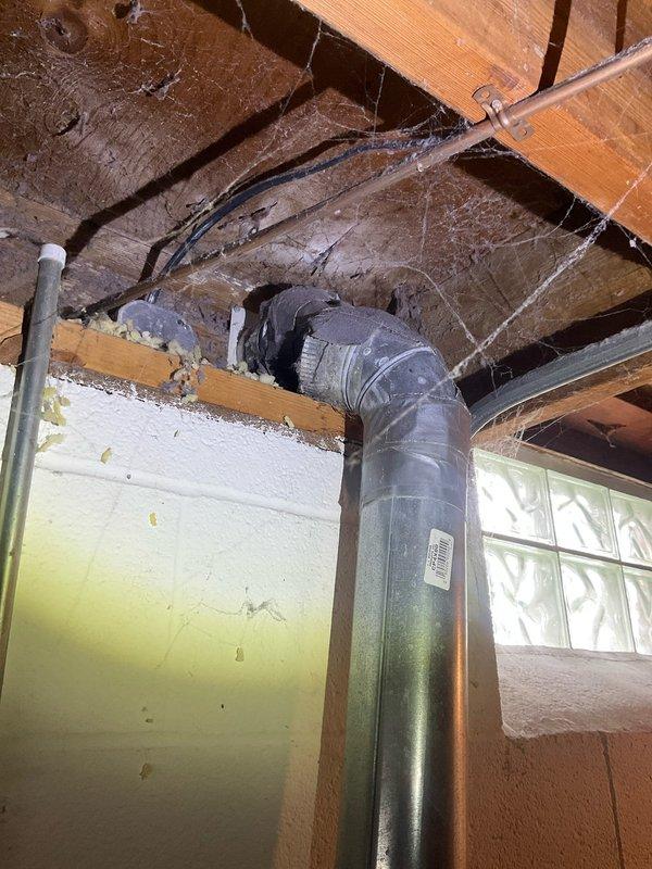 Completed comprehensive plumbing assessment of basement utility systems, including inspection of sump pump discharge piping and dryer vent configuration. Documented existing ductwork conditions, noting vertical metallic duct installation with flexible connectors, PVC drainage piping, and HVAC components with photographic evidence for customer reference and future service planning.