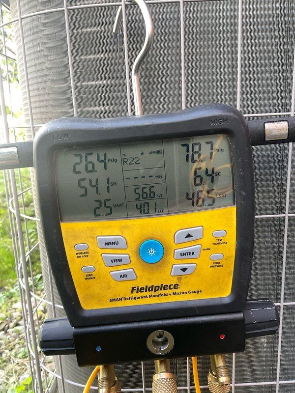 Performed routine cooling system maintenance on residential outdoor condensing unit. Conducted diagnostic measurements using refrigerant manifold and micron gauge, verifying system temperatures, pressures, and humidity levels. Inspected evaporator coil condition, confirmed fins were clean and free of debris. Unit operating within normal parameters with proper refrigerant charge and airflow.