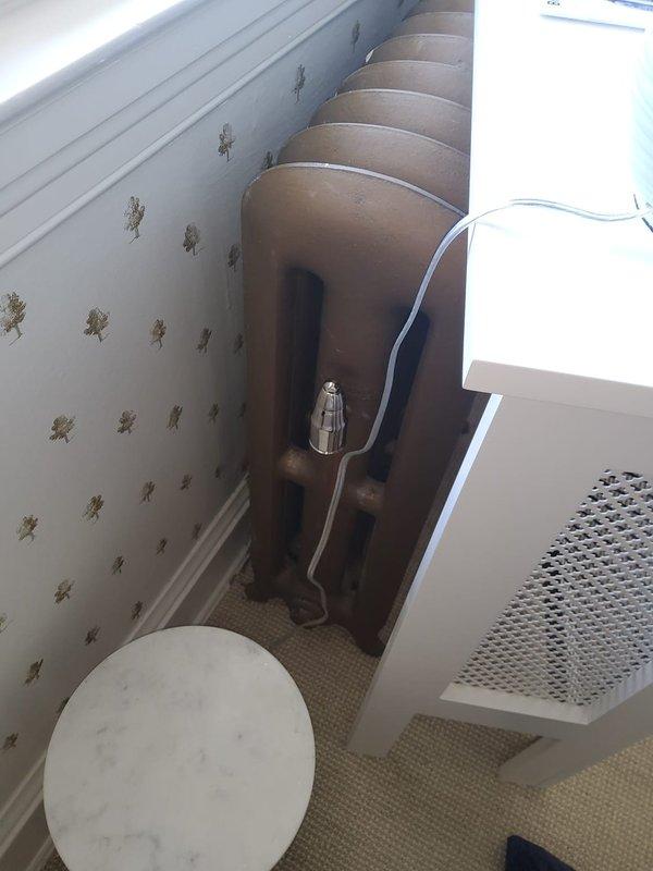 Responded to service call for inconsistent heating in nursery room of residence with 16-year-old furnace system. Inspected traditional radiator heating units throughout home, including nursery radiator and connecting piping. Verified proper heat distribution, checked radiator valve operation, and confirmed system functionality. All radiators found operating within normal parameters with adequate heat output to occupied spaces.