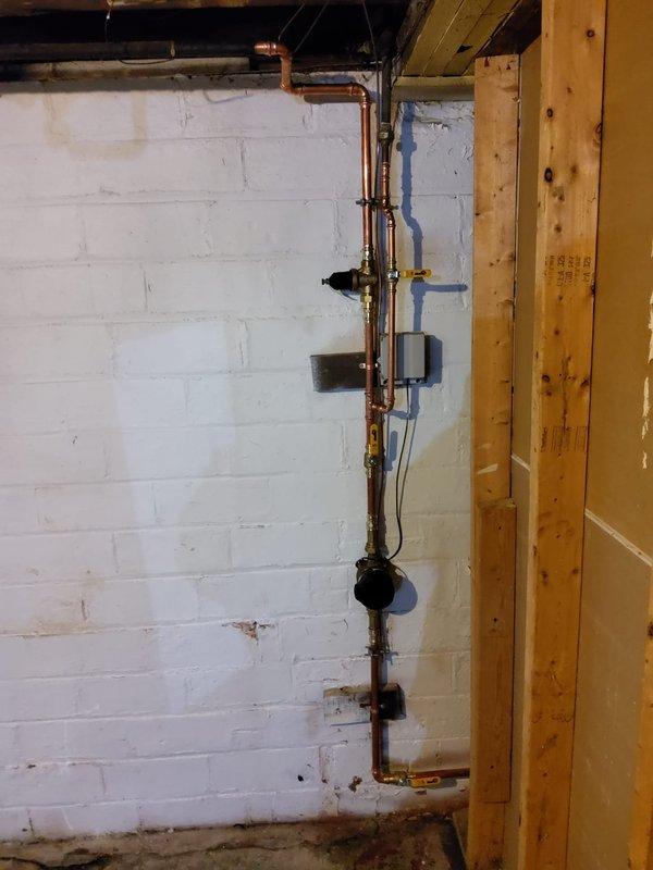 Responded to service call regarding scheduled city water shutoff. Removed all existing shark bite fittings above and below the water meter, along with a leaking elbow fitting. Replaced faulty pressure reducing valve and main water valve assembly. Installed new 3/4-inch brass water main interior shutoff valve on interior plumbing system. Tested valve operation to ensure proper functionality and inspected all connections for leaks. All copper piping connections secured and system restored to full operation upon confirmation of city water service restoration.