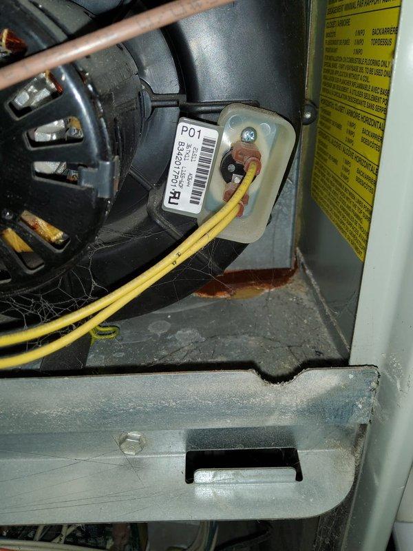 # HVAC Maintenance - Cooling System Service

Performed comprehensive preventive maintenance on a 20+ year old heat pump system during first service call. Upon inspection, unit showed significant age-related deterioration including heavy rust and corrosion on interior metal components and panels, with visible mineral deposits and efflorescence indicating previous moisture exposure. Blower motor assembly and electrical connections were inspected and found operational despite equipment age. Cleaned accumulated dust, debris, and cobwebs from interior compartments. Verified proper electrical connections at motor terminals and control components. Assessed refrigerant line routing and condition. System operational at time of departure, though advanced age and corrosion levels noted for customer awareness regarding future equipment considerations.