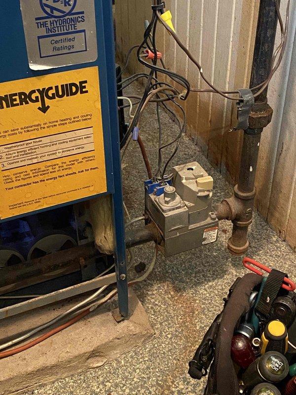 Responded to service call for steam boiler with reported slushing sound at bottom of unit and concerns about potential leak. Upon inspection, assessed boiler system and associated components including electrical controls and piping infrastructure. Documented existing conditions showing signs of aging equipment with visible rust on vertical piping and standard wear on mechanical components, though no active leaks were identified during visual inspection at time of service.