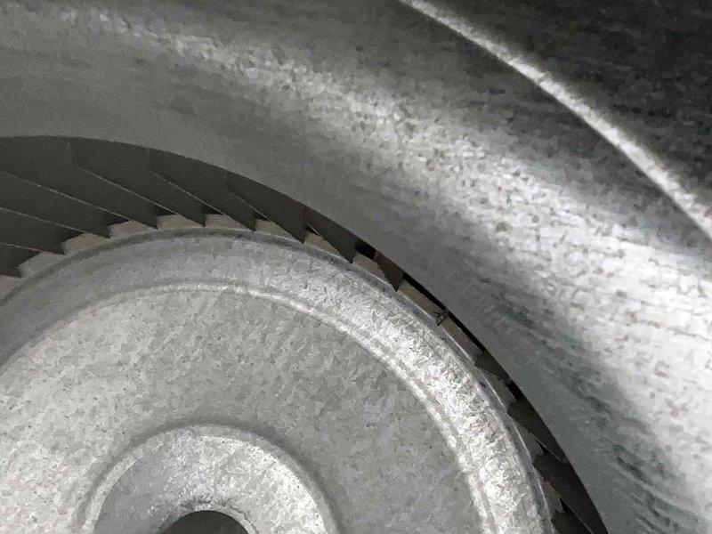 Completed routine cooling system maintenance on HVAC unit. Upon inspection, discovered significant frost and ice buildup on evaporator coil and surrounding components, indicating potential airflow restriction or refrigerant issue. Documented system condition with photographs showing heavily frosted coil fins and blower assembly. Inspected blower wheel, which showed dust accumulation on blades but remained operational. System requires contract renewal for continued service coverage.