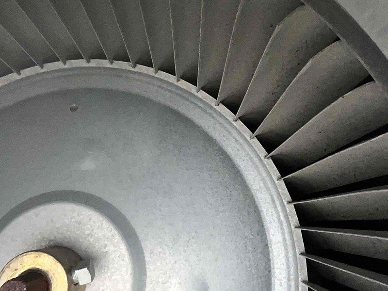 Completed routine cooling system maintenance on HVAC unit. Upon inspection, discovered significant frost and ice buildup on evaporator coil and surrounding components, indicating potential airflow restriction or refrigerant issue. Documented system condition with photographs showing heavily frosted coil fins and blower assembly. Inspected blower wheel, which showed dust accumulation on blades but remained operational. System requires contract renewal for continued service coverage.