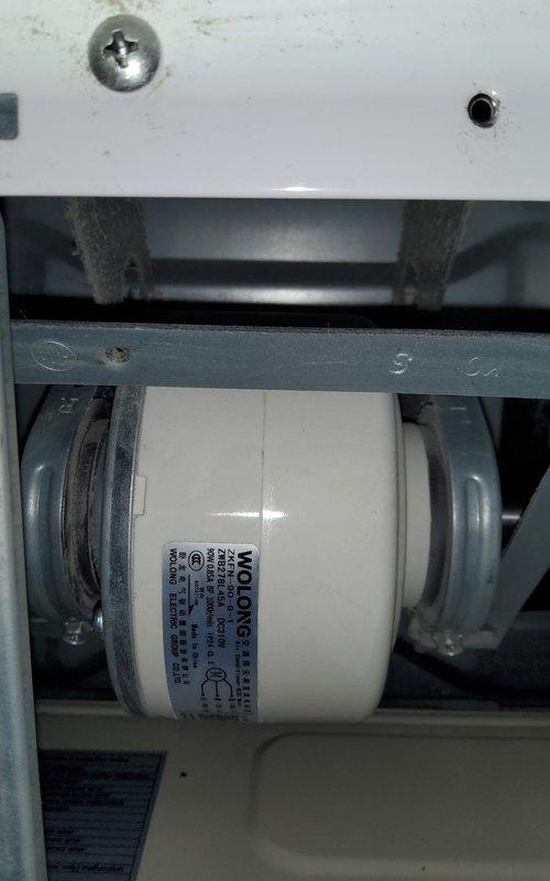 Responded to service call for four-year-old ductless mini split system experiencing light grinding noise indicative of potential bearing failure. Upon arrival, performed diagnostic inspection of floor-mounted indoor unit and accessed internal components to identify noise source. Inspection revealed worn blower motor bearings causing mechanical grinding during operation. Documented equipment condition through photography showing both external unit installation and internal motor assembly with visible wear on cylindrical blower motor component. Evaluated motor mounting brackets and housing for additional mechanical issues. Provided customer with findings regarding bearing deterioration and recommended motor replacement to prevent complete failure and restore quiet operation.