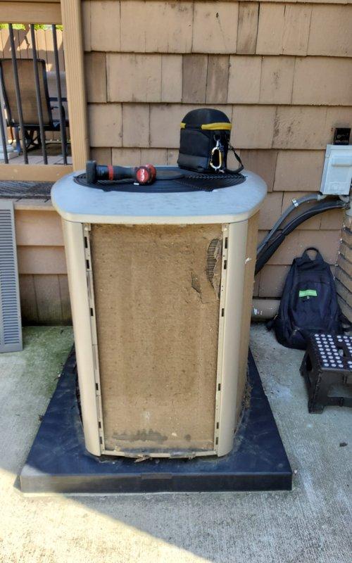 Completed comprehensive tune-up on outdoor air conditioning unit over 10 years old. Performed standard maintenance protocol including inspection of all major components, cleaning of heavily soiled condenser coil and filter screen which showed significant dust and debris accumulation, verification of refrigerant levels, electrical connection testing, and operational assessment. Unit returned to proper working condition with improved airflow efficiency following removal of substantial particulate buildup from intake surfaces.