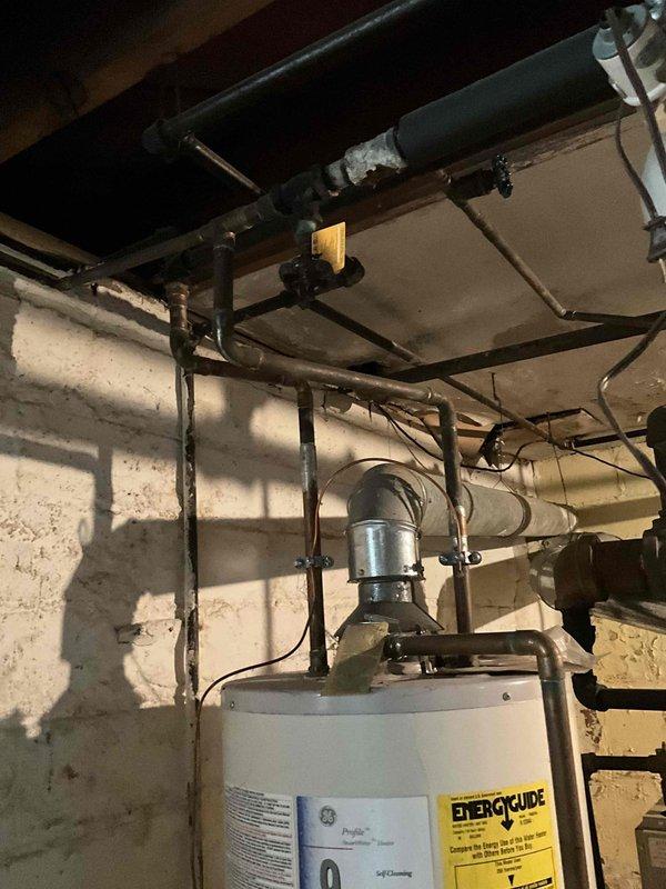 Conducted estimate for steam boiler system with compromised heat exchanger. Inspection revealed hole in heat exchanger requiring replacement, documented condition with photos of boiler unit and associated piping infrastructure. Provided assessment and replacement recommendations to address failed component.