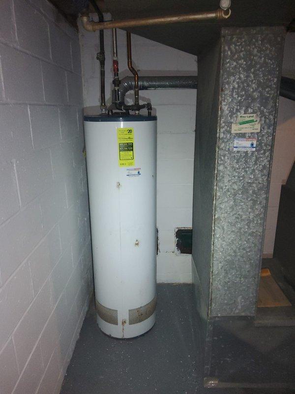 Performed comprehensive whole-home plumbing assessment to evaluate reported issues including kitchen sink drainage problems, top floor sink not draining, lack of cold water supply to upstairs sink, and malfunctioning drain plug in upstairs sink. Inspected and documented existing water heater installation in basement utility room, noting all supply line connections, piping configurations, and ventilation components. Provided homeowner with complete findings and recommendations for addressing identified plumbing concerns throughout the residence.