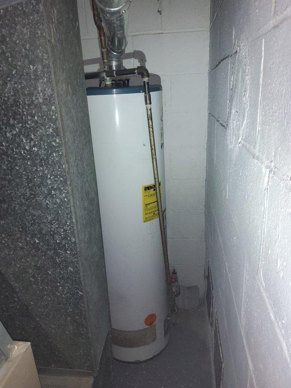 Performed comprehensive whole-home plumbing assessment to evaluate reported issues including kitchen sink drainage problems, top floor sink not draining, lack of cold water supply to upstairs sink, and malfunctioning drain plug in upstairs sink. Inspected and documented existing water heater installation in basement utility room, noting all supply line connections, piping configurations, and ventilation components. Provided homeowner with complete findings and recommendations for addressing identified plumbing concerns throughout the residence.