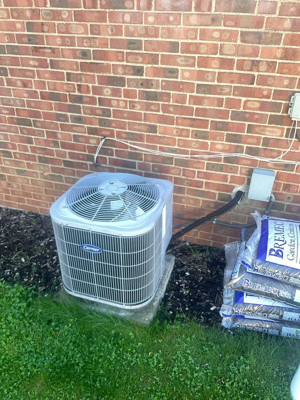 Performed comprehensive annual maintenance on an 11-year-old Carrier air conditioning system during first service visit. Conducted full system diagnostics using calibrated manifold gauges to measure refrigerant pressures and temperatures, verified proper system operation, and inspected condenser unit exterior condition including coil fins and protective guards. All components found operating within manufacturer specifications with no deficiencies noted.