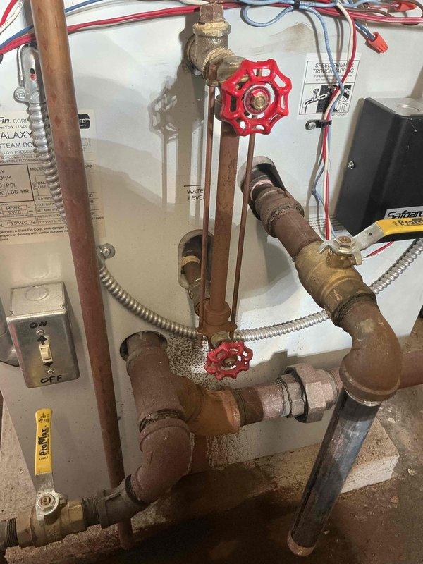 Replaced sight glass assembly on hydronic heating system. Removed failed sight glass from copper piping network and installed new stock assembly, ensuring proper sealing and connection integrity. System includes multiple zone valves and control components; verified all connections secure and tested for leaks upon completion.