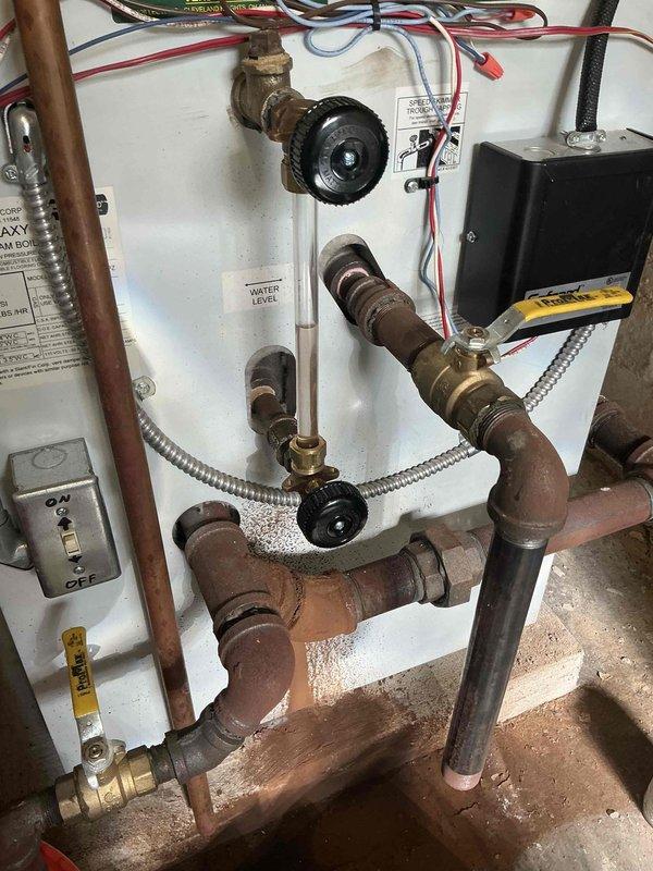 Replaced sight glass assembly on hydronic heating system. Removed failed sight glass from copper piping network and installed new stock assembly, ensuring proper sealing and connection integrity. System includes multiple zone valves and control components; verified all connections secure and tested for leaks upon completion.