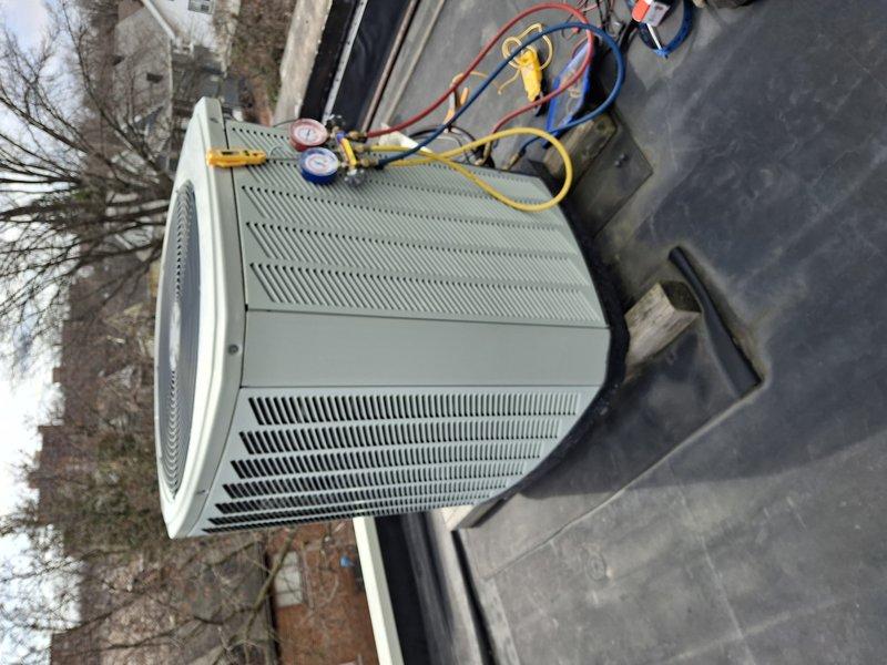 Completed rooftop HVAC system maintenance by retrieving and installing air filters that were required from a previous appointment. Connected manifold gauges to the condensing unit to verify system pressures and operational performance during the filter replacement service.