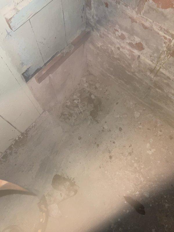 Completed partial stack replacement in plumbing system. Removed deteriorated stack section showing significant corrosion, dark staining, and residue buildup on piping components. Toilet was temporarily removed to access work area and will be reinstalled upon completion of stack installation. Work area showed evidence of water damage and material deterioration requiring intervention.