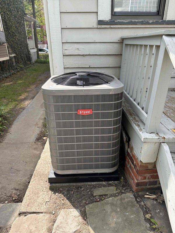 Completed full HVAC system installation including new Bryant outdoor condensing unit, evaporator coil, refrigerant line set, and thermostat. Unit was positioned on concrete pad against exterior wall with proper clearances maintained. All refrigerant lines were properly installed and insulated, with system evacuated and charged to manufacturer specifications. System pressures were verified using calibrated manifold gauges, confirming proper refrigerant charge with readings of 97.5 psig suction and 227.3 psig discharge. Final testing confirmed all components operating within normal parameters with appropriate superheat and subcooling values achieved.