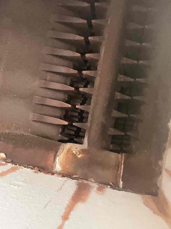 Completed annual maintenance inspection on 12-year-old boiler system. Performed comprehensive system evaluation including visual inspection of heat exchanger, circulator pump, and distribution piping. Inspected finned tube radiator for proper heat distribution and noted age-appropriate surface oxidation with no operational concerns. Examined circulator pump assembly with zone valve controls and verified proper mechanical operation. Observed existing corrosion on copper piping connections and fittings consistent with system age; corrosion is superficial and does not currently affect system integrity or performance. Checked all shut-off valves for proper operation. Verified electrical connections and flex conduit routing to pump motor. System operating within normal parameters for unit age. Recommended monitoring pipe corrosion progression during future service visits. All components functioning as designed with no immediate repairs required.