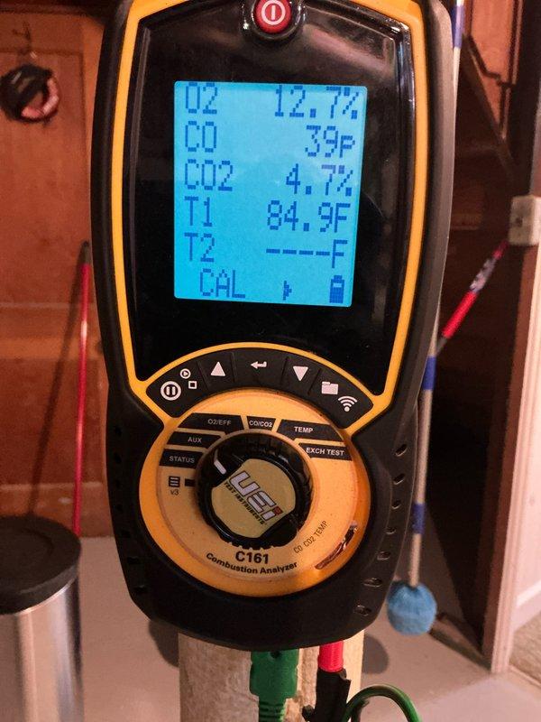 Completed annual furnace tune-up and safety inspection on gas heating system. Verified proper burner operation with clean blue flame pattern across all ports, performed combustion analysis confirming acceptable efficiency levels with O2 reading at 12.7% and CO2 at 4.7%. Inspected gas valve assembly, electrical connections, and safety controls; all components found operating within normal parameters with no issues identified.