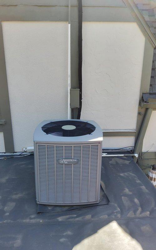 Completed comprehensive cooling system tune-up on rooftop-mounted Armstrong air conditioning unit and associated wall-mounted components. Performed standard preventive maintenance procedures including inspection of condenser unit, refrigerant line sets, electrical connections, and outdoor equipment installation integrity. All systems evaluated and found operating within normal parameters, with photographic documentation captured for service records.