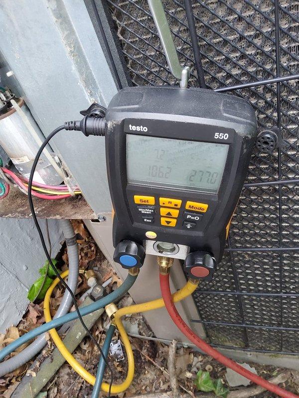Responded to no cooling complaint with visible frost and ice accumulation on outdoor unit. Connected digital manifold gauges to system and performed refrigerant pressure diagnostics to identify root cause of freezing condition and system malfunction.