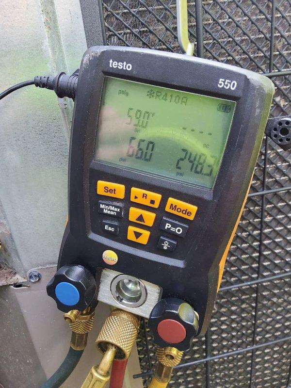 Responded to no cooling complaint with visible frost and ice accumulation on outdoor unit. Connected digital manifold gauges to system and performed refrigerant pressure diagnostics to identify root cause of freezing condition and system malfunction.