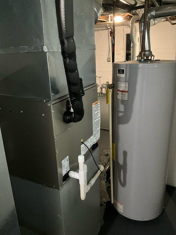 Completed full replacement of two air conditioning systems with matching evaporator coils at residential property. First unit installed in basement mechanical room, second unit installed in attic space. Both installations utilized existing refrigerant line sets to minimize invasive work and reduce installation time. New condensing units properly positioned and secured, with evaporator coils matched to manufacturer specifications for optimal system performance. All electrical connections terminated per code requirements, condensate drain lines installed with appropriate traps and routing. Systems pressure tested, evacuated, and charged to manufacturer specifications. Verified proper airflow, temperature differential, and operational parameters on both units before completing installation.