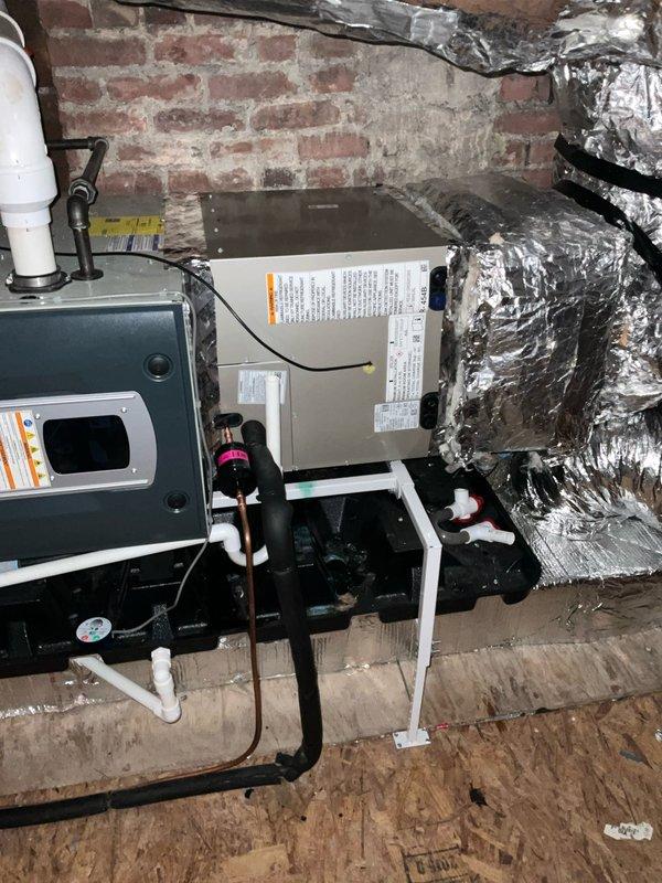 Completed full replacement of two air conditioning systems with matching evaporator coils at residential property. First unit installed in basement mechanical room, second unit installed in attic space. Both installations utilized existing refrigerant line sets to minimize invasive work and reduce installation time. New condensing units properly positioned and secured, with evaporator coils matched to manufacturer specifications for optimal system performance. All electrical connections terminated per code requirements, condensate drain lines installed with appropriate traps and routing. Systems pressure tested, evacuated, and charged to manufacturer specifications. Verified proper airflow, temperature differential, and operational parameters on both units before completing installation.