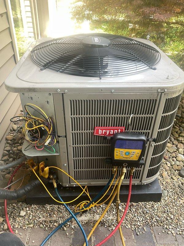 Performed comprehensive tune-up on 3-year-old Bryant central air conditioning system. Connected manifold gauges and recorded system pressures and temperatures, verifying proper refrigerant charge and operational parameters across both low and high-side pressures. Inspected outdoor condenser unit, confirmed proper airflow through coils, and verified all electrical connections and components functioning within normal specifications.