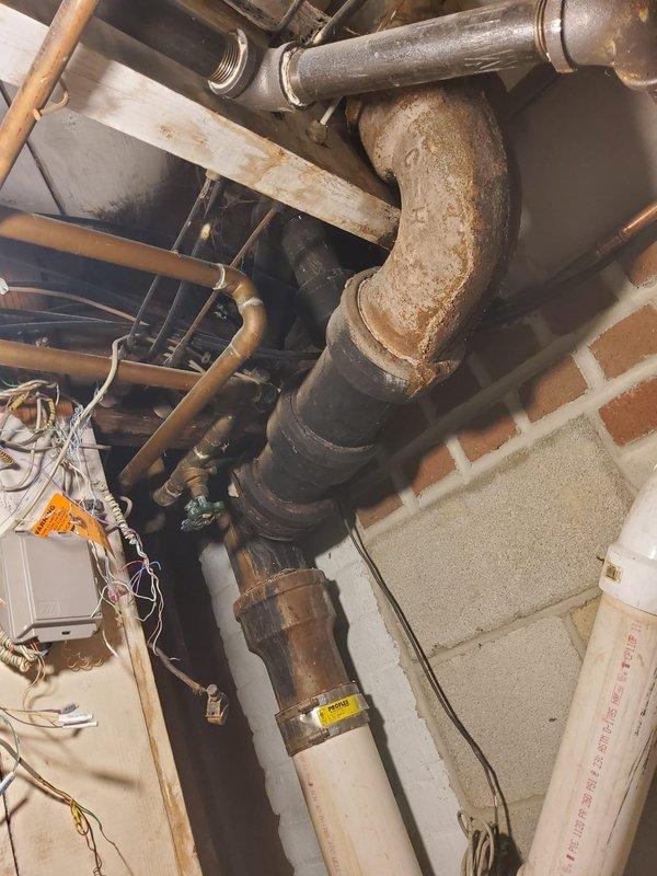 Replaced aged and heavily corroded exterior hose bibb with a new long shank boiler drain style spigot featuring a 1/2" connection. The installation was designed to position the connection away from the house exterior for improved accessibility and ease of use. The existing plumbing showed significant oxidation and weathering, requiring removal of the deteriorated fixture and proper installation of the upgraded assembly to ensure reliable water delivery and prevent future leakage issues.