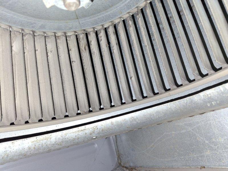 Completed preventative maintenance on 16-year-old air conditioning system. Inspected and documented blower assembly showing dust accumulation on squirrel cage fan blades, indicating normal operational wear. Performed system diagnostics using digital manifold gauge, recording refrigerant pressures and verifying proper operation of outdoor condensing unit.