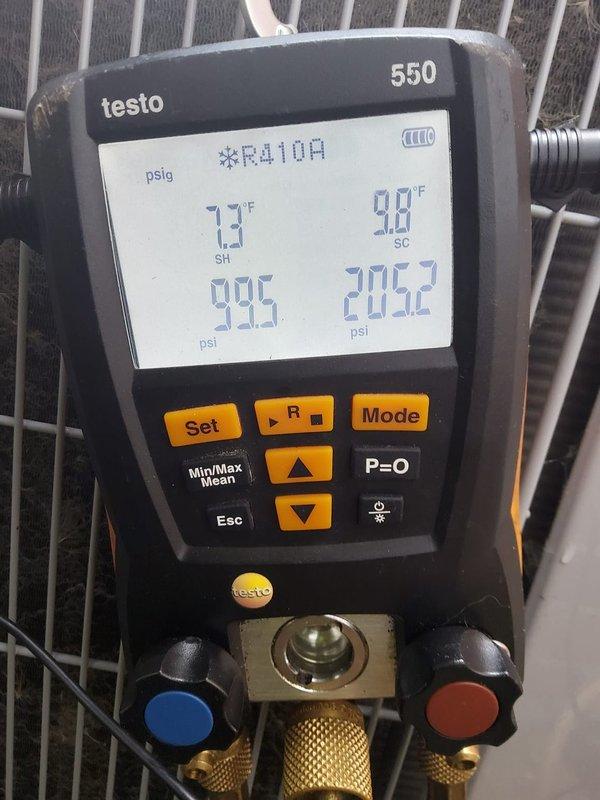 Completed comprehensive air conditioning tune-up and maintenance service on R410A cooling system. Performed full system diagnostics using digital manifold gauges, recording operating pressures and temperatures to verify proper refrigerant charge and system performance. Low-side pressure measured at 99.5 psi with 13.7°F superheat, high-side pressure at 205.2-206.2 psi with 9.8°F subcooling, confirming system is operating within manufacturer specifications. All measurements indicate proper refrigerant charge levels and efficient heat transfer. System found to be in good working condition with no deficiencies noted during inspection.