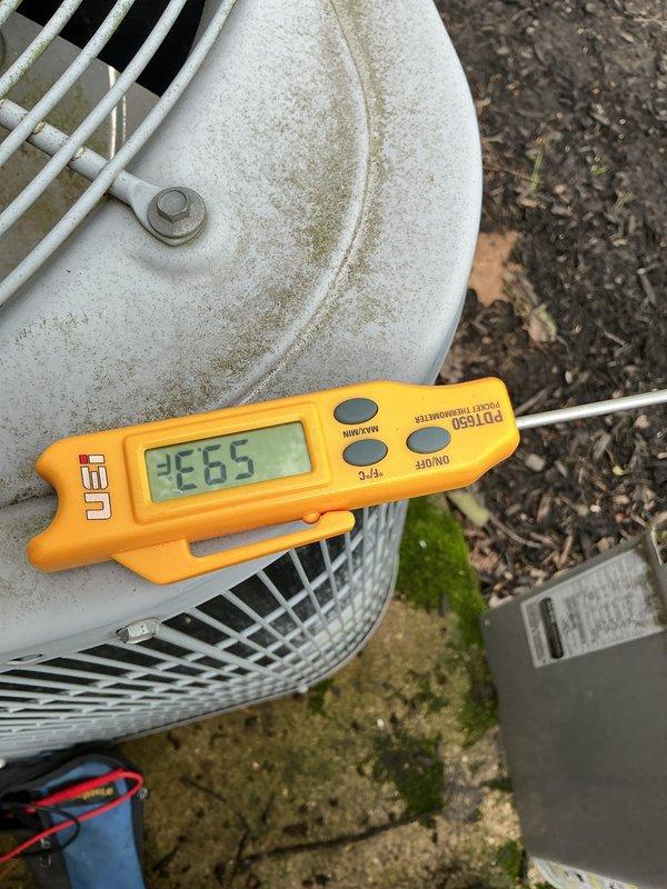 Completed comprehensive cooling maintenance tune-up on three residential air conditioning systems of varying ages (10+ years and 2+ years old) as part of recurring home plan service. Performed standard 8-12 point maintenance protocol on all units including refrigerant pressure testing, temperature differential measurements, and visual equipment inspections.

Conducted thorough examination of outdoor condenser units, measuring system performance with calibrated digital thermometer showing temperature readings within operational parameters. Inspected condenser coil grilles and housings, noting accumulated dirt, debris, and environmental weathering consistent with outdoor exposure and system age. Documented equipment condition with service photographs showing typical wear patterns and surface discoloration on older units.

Assessed installation pads and surrounding areas, observing moss and algae growth on concrete surfaces indicating adequate drainage but extended moisture exposure. Clea