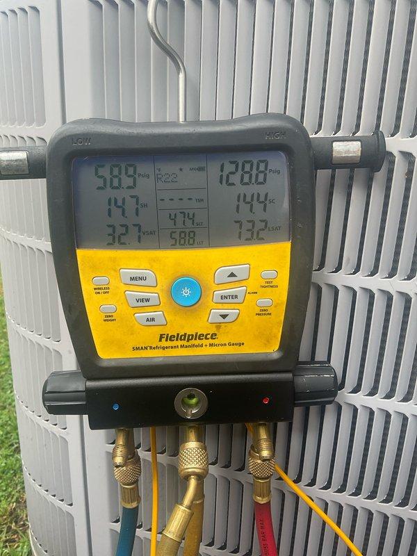 Performed comprehensive cooling system maintenance and diagnostics on outdoor condensing unit. Connected refrigerant manifold gauges to service ports and recorded system pressures and temperatures. Measured superheat at 14.7°F and subcooling at 32.1°F to verify proper refrigerant charge levels. System pressures reading 58.5 PSI on low side and 128.8 PSI, indicating acceptable operating parameters for current ambient conditions.

Conducted electrical diagnostics using digital multimeter to test capacitor functionality. Measured capacitance reading of 623.4 microfarads on run capacitor to ensure proper motor starting and operational efficiency. Verified electrical connections and component integrity throughout the unit. 

Inspected condenser coil fins for cleanliness and airflow restrictions. Evaluated overall unit operation and confirmed system cycling properly. All measurements within manufacturer specifications for optimal cooling performance.